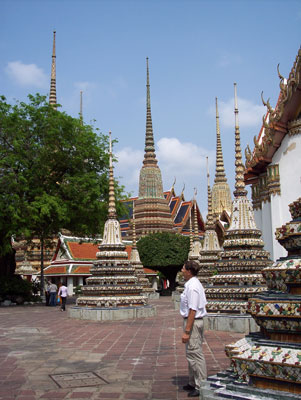 Randy admiring the decorative chedis at the Temple of the Reclining Buddha.