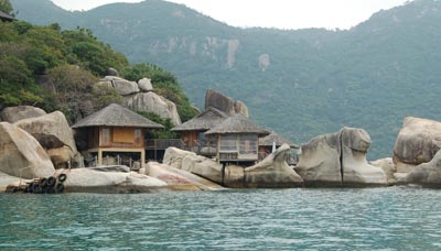 Water villas at Six Senses Hideaway on Ninh Van Bay.