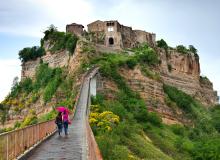 A footpath is all that connects Italy’s Civita di Bagnoregio to the “mainland.” Photo by Dominic Arizona Bonuccelli