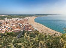 Nazaré hugs its wide beach on the Atlantic. Photo by Dominic Arizona Bonuccelli