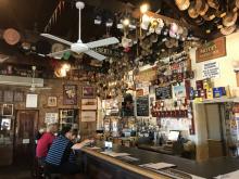 Hats and caps cover the rafters in the Birdsville Hotel pub, a welcome watering hole for visitors and locals — Birdsville, Queensland. Photos by David Bentley