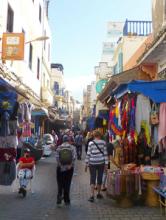 Visitors exploring the colorful medina in Essaouira. Photo by Randy Keck