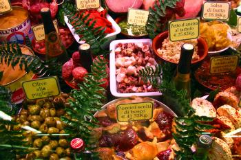 Florence's Mercato Centrale bursts with colorful meats, olives, produce, and cheeses - perfect for cobbling together a little Florentine picnic. Photo by Ben Cameron